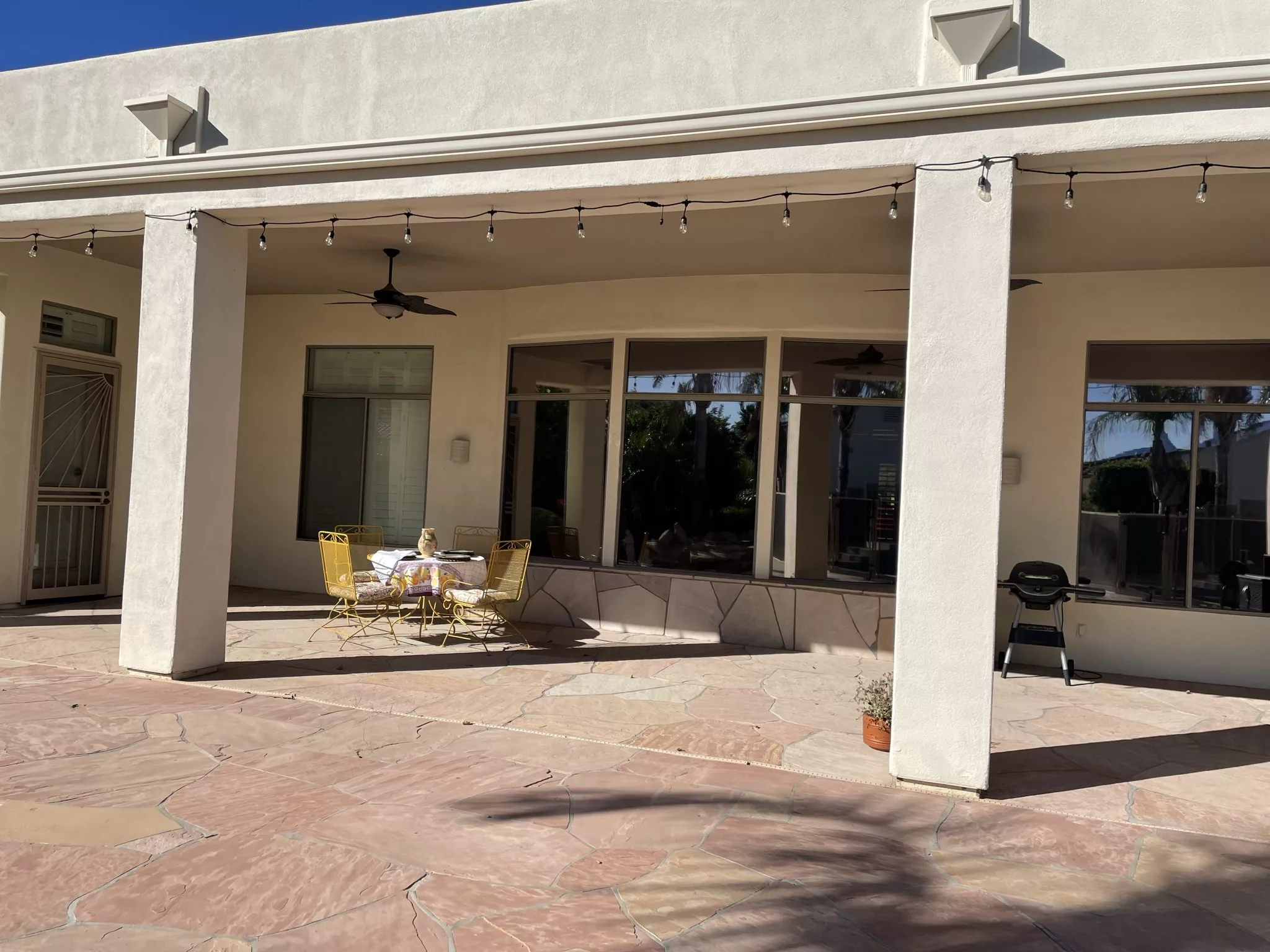 Outdoor patio with seating and shade