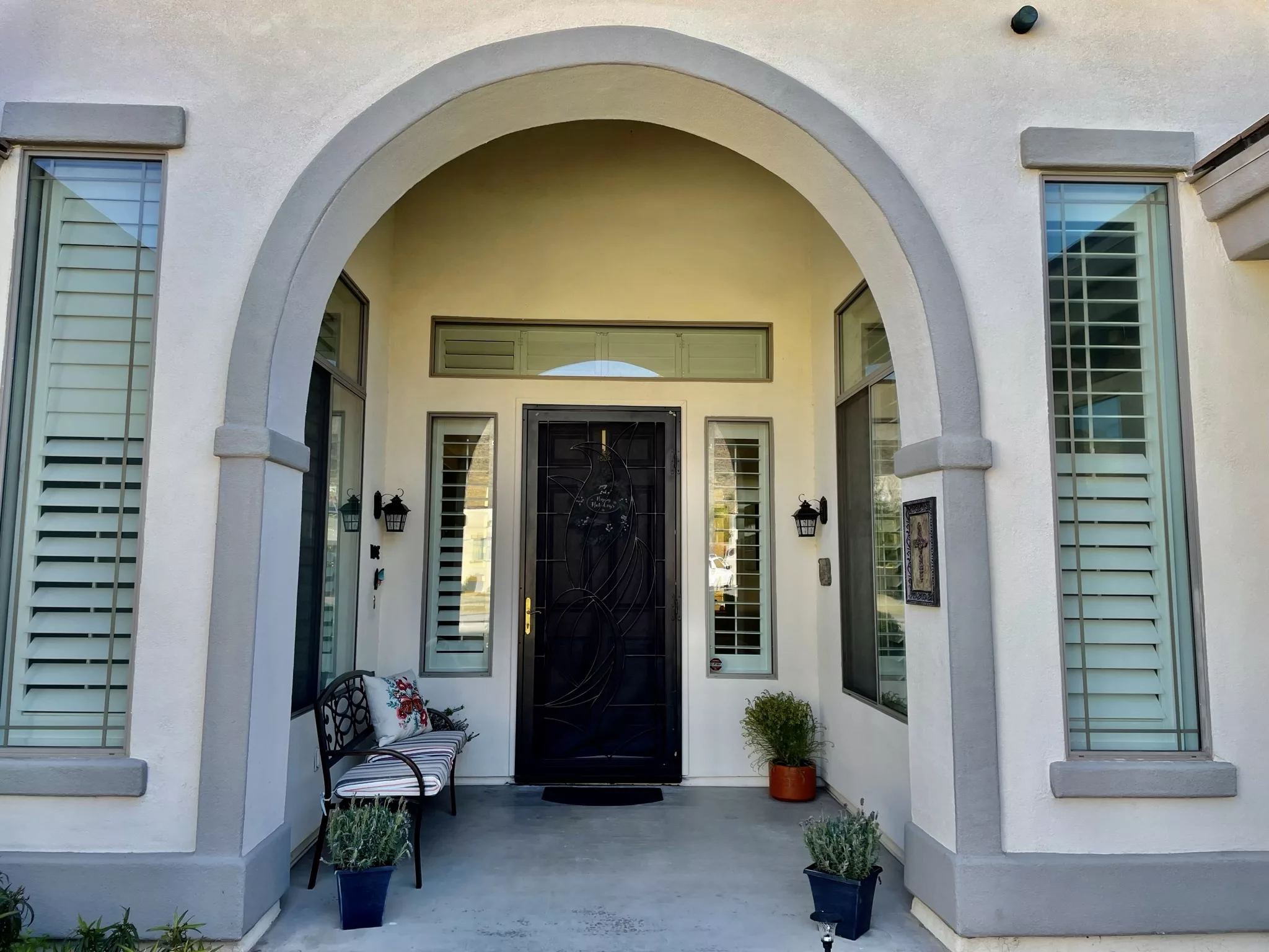 Entrance of a residential facility with decorative bench