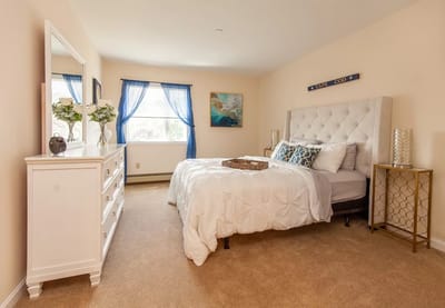 Cozy private room featuring a bed and natural light