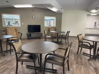 Common area with tables and chairs in a lounge