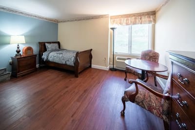 Well-furnished private resident room with natural light