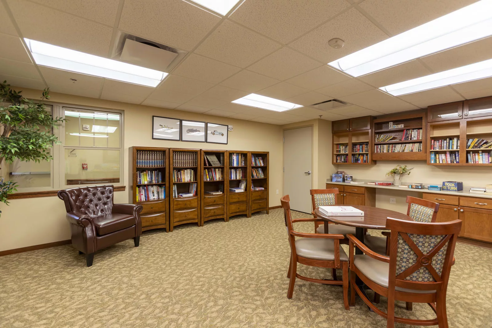 Bright common area with bookshelves and seating