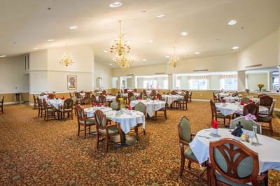 Dining area with tables set for meal service