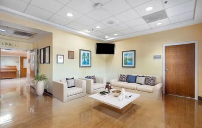 Bright common area with seating and artwork