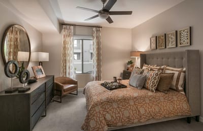 Cozy and well-decorated resident room with a bed and decor