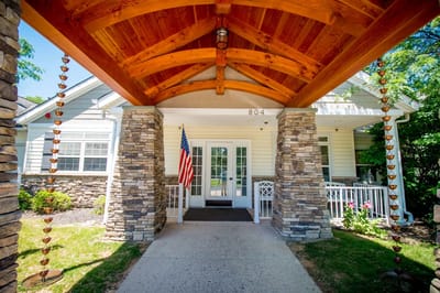 Exterior view of the facility entrance with wooden details
