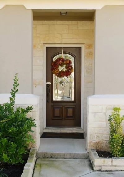 Front entrance of Isabel's Place with a seasonal wreath