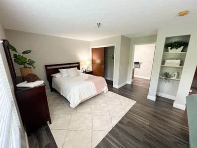 Cozy interior of a private resident room with a bed and furniture