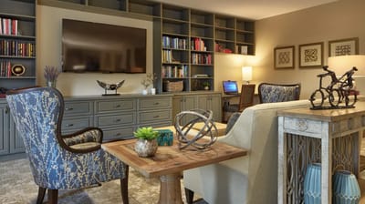 Cozy common area with bookshelves and seating