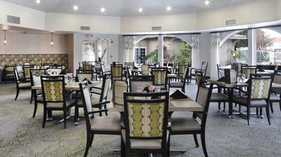Bright dining area with tables set for meals