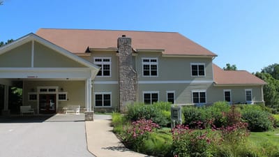 Exterior view of Jill's House Inc. with gardens