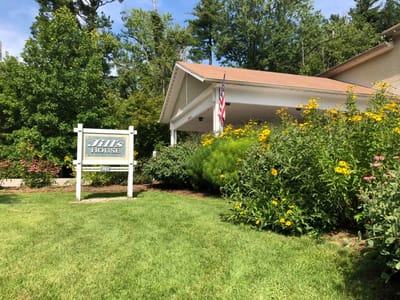 Building exterior of Jill's House with garden