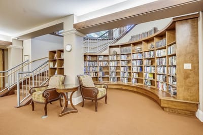 Cozy reading area with bookshelves and seating