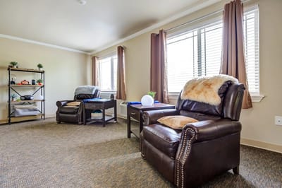 Cozy seating area with natural light and plants