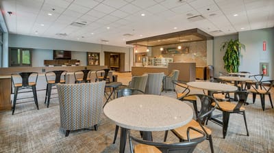 Bright common area with seating and a counter