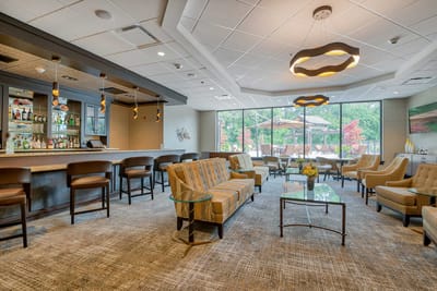 Bright common area with comfortable seating and outdoor view