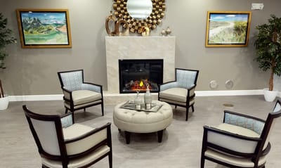 Common area with seating and decorative fireplace