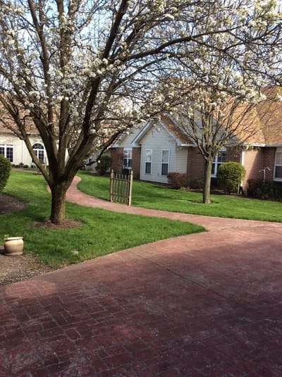 Pathway in a landscaped outdoor area of a senior facility
