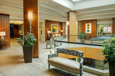 Bright and welcoming common area with seating and plants