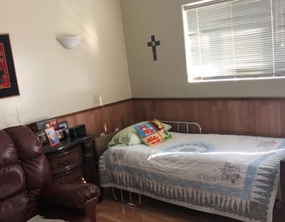 Private resident room with a bed and seating area