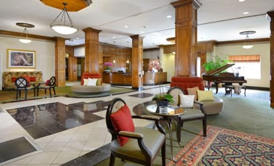 Elegant common area with seating and a piano