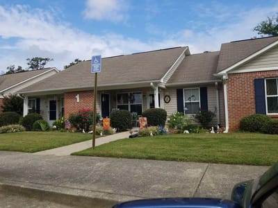 Exterior view of assisted living cottages with gardens