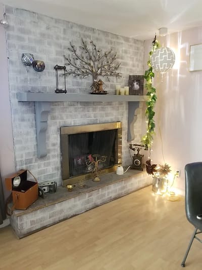 Cozy interior decor featuring a fireplace and wall art