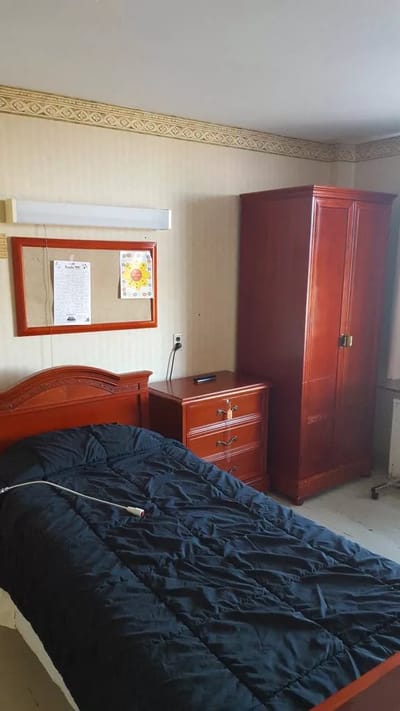 Private resident room with a bed and furniture
