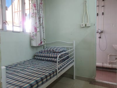 Private resident room with a bed and shower