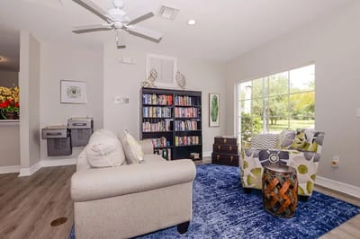 Cozy lounge area with bookshelves and seating