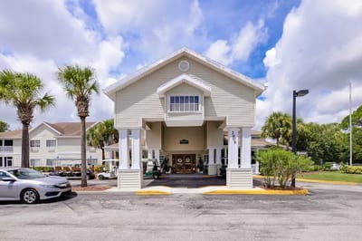 Exterior view of Lake Forest Park entrance with palm trees