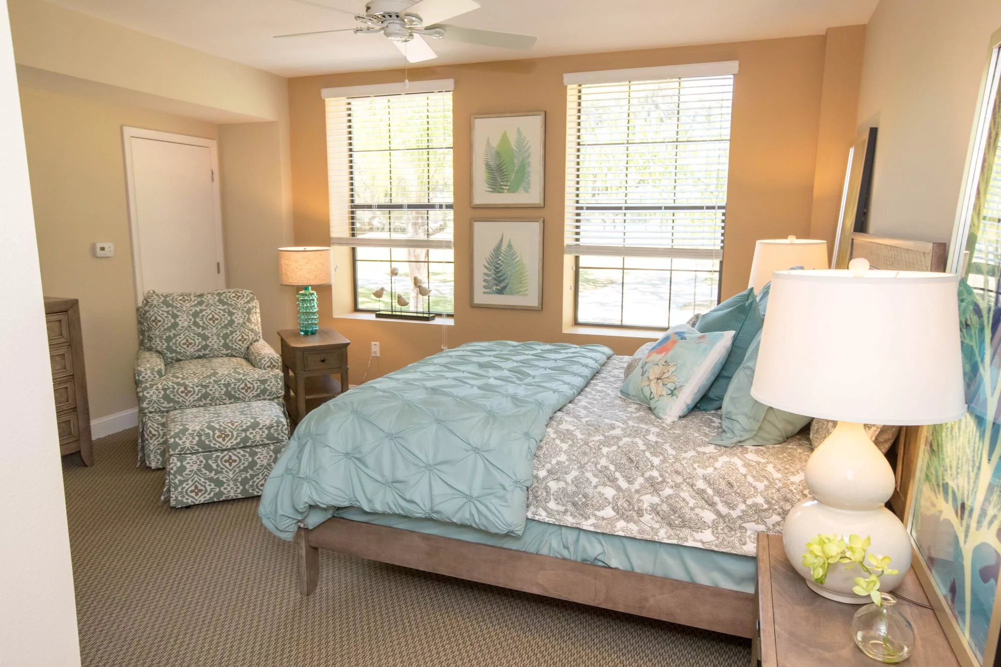 Well-decorated resident room with natural light