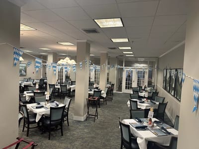 Bright dining room with festive decorations and seating