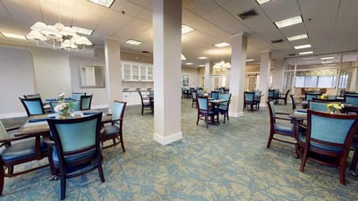 Bright and spacious dining room with multiple tables