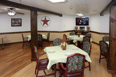 Dining room with tables and chairs for residents