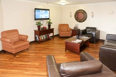 Cozy common area with seating and a TV