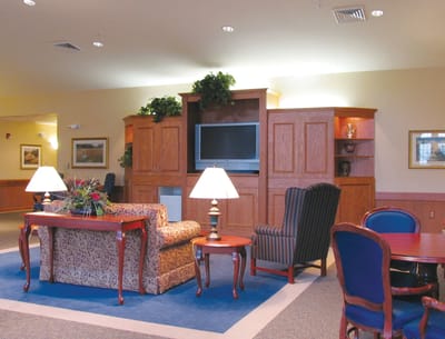 Bright common area with seating and television