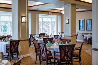 Dining area with tables set for residents