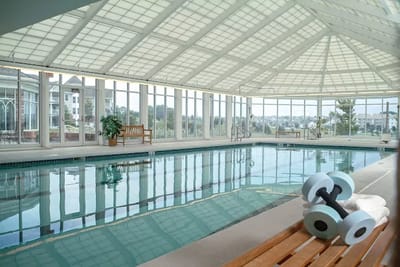 Indoor swimming pool with weights and benches