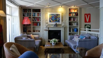 Cozy living room with bookshelves and comfortable seating