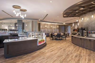 A beautifully designed dining area with modern decor and seating