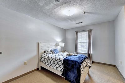 Cozy private room with a bed and window