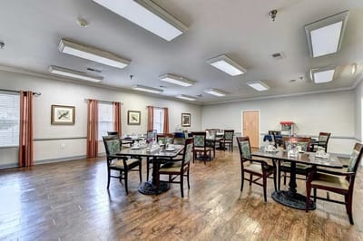 Dining room with tables and chairs set for meals