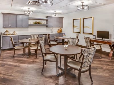 Bright common area with tables and chairs