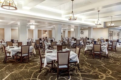 Dining area with tables set for residents