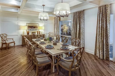 Dining room set for a meal in a cozy environment