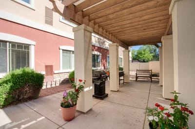 Outdoor patio area with seating and grills