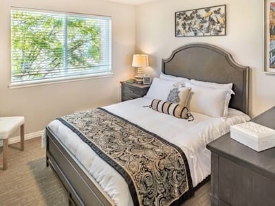 Cozy interior of a private resident room with a bed and window