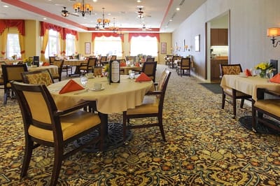 Dining room with tables set for a meal
