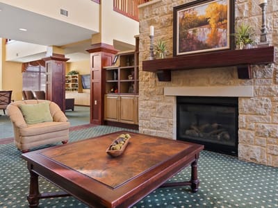 Cozy common area with a fireplace and seating